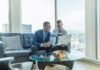 Top 5 Strategies for Effective Wealth Management two men in suit sitting on sofa