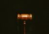 How Do You Make a Power of Attorney Effective? brown wooden stand with black background