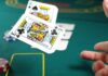 How to Gamble from Restricted Countries in 2023 Image of a man throwing away playing cards