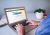 HOW TO REDESIGN YOUR SITE WITH SEO IN MIND person using macbook air on white table