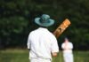 Top 3 Most Popular Cricket Betting Apps You Can Make Money man in white shirt and brown pants wearing brown cowboy hat standing on green grass field