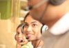 Measuring Success: Analytics and Reporting in Best Call Center Software woman in black headphones holding black and silver headphones