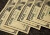 Top Liquidity Providers: Unveiling Key Market Players a pile of twenty dollar bills laying on top of each other