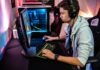 What’s the Right Video Game Difficulty for a Beginner? a man sitting at a computer with headphones on