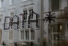 Unleashing Privacy Protection: Unveiling the Best Data Masking Tools a close up of a window with a building in the background