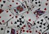 The Order of Poker Hands: A Comprehensive Guide for Casual Poker Players a pile of playing cards sitting on top of each other