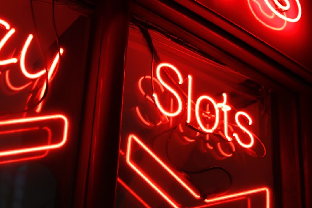 Photo by Aarón González red and white love neon light signage