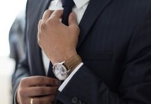 As a Lawyer, You Need to Be Good at Generating New Business. man wearing watch with black suit