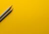 Wrap it Up- The Ultimate Guide to Trailer Graphics and Wraps two gray pencils on yellow surface