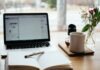 The Global Marketing Appeal: Why Esteemed Brands Embrace Tech-Enhanced Flyer Distribution for Unmatched Marketing Impact MacBook Pro near white open book