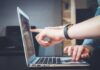 Domain Redirect Traffic: Pros and Cons person using laptop