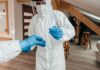 VPAT Testing: Ensuring Accessibility for All a person in a white suit and blue gloves