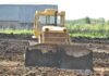 Creative Uses for Used Bobcat Skid Loaders a bulldozer is sitting in the middle of a field
