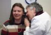 How Does Lenire Tinnitus Treatment Work? a woman talking on a cell phone next to a man