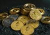Game of Chance: Exploring the Popularity of Slots in Cryptocurrency Casinos a pile of bitcoins sitting on top of a pile of gravel