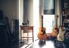 several guitars beside of side table