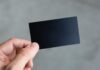 Tailoring Gift Certificates to Your Clients: A Guide to Thoughtful Giving person holding black rectangular paper