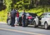 Navigating the Legal Landscape of Car Accidents in Denver man in black t-shirt and black pants standing beside black suv during daytime