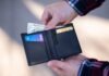 Payouts at Warp Speed: Where to Play for Quick Cash black leather bifold wallet on persons hand