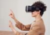 The Future of Virtual Reality in Online Casinos Woman Using Virtual Reality Goggles
