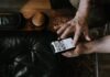 Heartbeats and Hashtags: The Merging Worlds of Love and Technology Person Using a Smartphone with Dating-Matching App on Screen