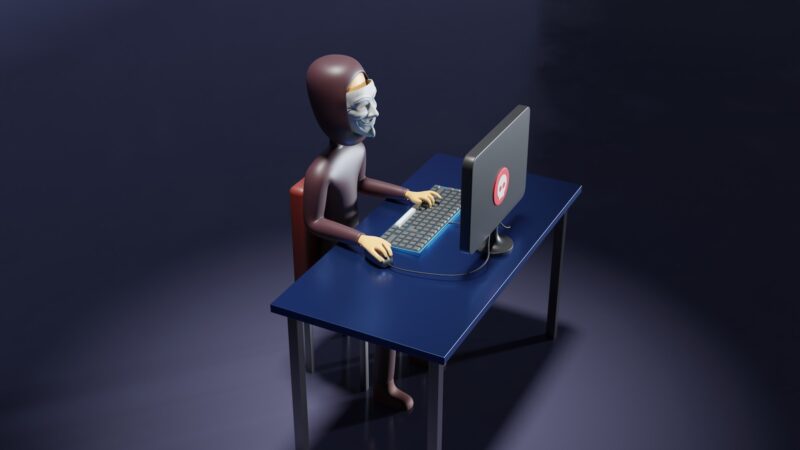 Photo by Growtika a skeleton sitting at a desk with a laptop and keyboard