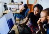 Revolutionize Your Business With Advanced Software woman and man sitting in front of monitor