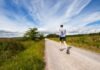 Poppers and Wellbeing: Addressing Misconceptions and Promoting Health man running on road near grass field