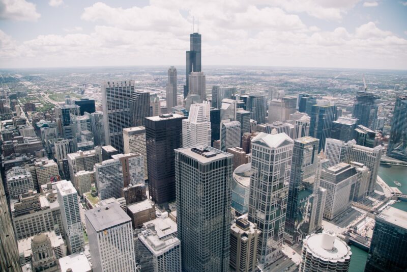 Photo by Justin Eisner Sears Tower, USA under white clouds at daytime