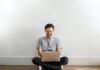 How Technology Has Given Rise to the Increased Popularity of Online Casinos Photo of Laughing Man in Gray T-shirt and Black Jeans on Sitting on Wooden Floor While Using a Laptop