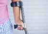 Frontline Legal Protection: Leading Personal Injury Lawyers in Phoenix a person holding a crutch and walking cane