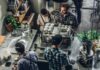 The Psychology of POD: Understanding Customer Buying Behavior man buying coffee on counter