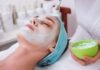 Ready to Unlock the Secret to Radiant Skin? Master These Skin Barrier Care Techniques for a Healthy Glow woman lying on blue towel with white cream on face