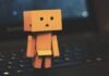 How AI Can Help You Develop Emotional Intelligence Danbo standing on laptop
