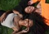 Expert Tips for Choosing High Quality Curly Clip In Hair Extensions two women lying on green grass