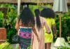 The Do’s and Don’ts of Dressing for a Resort Casual Event woman in yellow and red dress standing near people during daytime