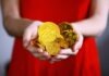 E-Yuan: Unveiling China’s Digital Evolution person holding gold-colored ching coins