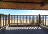 Transform Your Outdoor Space with a Louvered Patio Cover Patio with a View of Beach and Sea