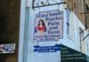 How Psychic Readings Shed Light on the Afterlife: Navigating the Beyond with Intuitive Wisdom a sign on the side of a building that says aura shop psychic palm and tar