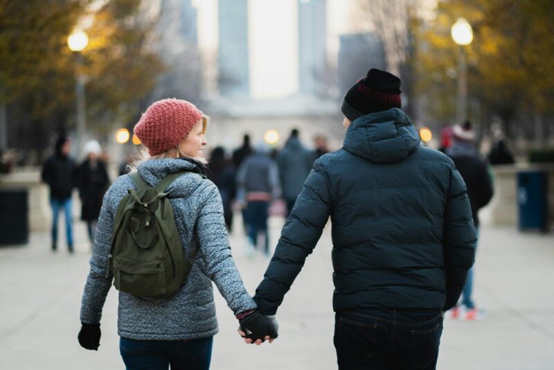 Photo by Josh Willink Man and Woman Holding Hands While Walking at Park