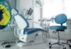 The Ultimate Guide to Finding the Best Dental Office in Alexandria, VA a dentist chair in a room with a painting on the wall