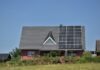 The Evolution of Integrated Energy Systems: A Holistic Approach to Sustainability a house with a solar panel on the roof
