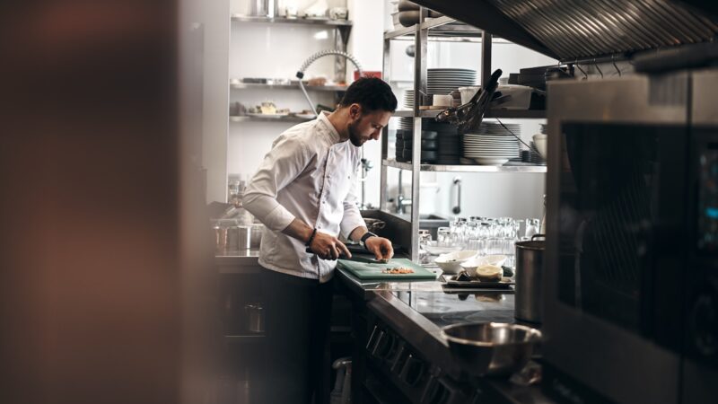 Photo by Pylyp Sukhenko man in white dress shirt holding white ceramic plate