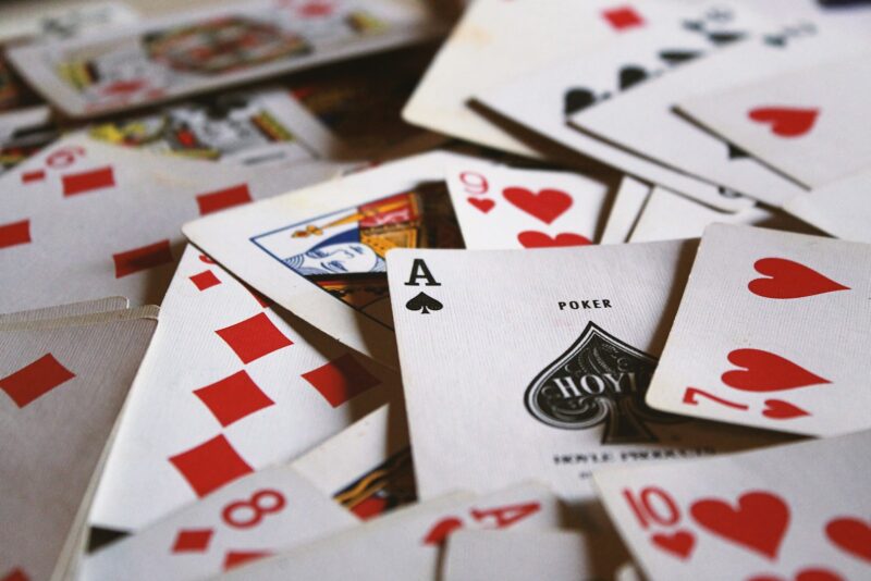 Photo by Jack Hamilton scattered playing cards