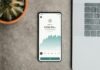 From Zero to Hero: How Smart Investing Can Change Your Life a cell phone sitting on top of a table next to a laptop