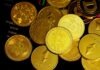 Bitcoin Blueprint: Your Guide to Building Wealth Through Cryptocurrency a pile of gold bitcoins sitting on top of each other