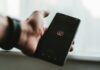 5 Best Sites to Buy Instagram Post Shares person holding black android smartphone