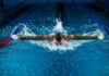 Balancing Safety and Play: Reducing Sports Injuries in Youth Athletes in Seattle man doing butterfly stroke