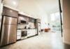 When Convenience Fails: Handling Smart Kitchen Appliance Malfunctions brown wooden kitchen cabinet near white wall