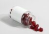 Why Emotional Health Supplements are a Booming Business a white and red capsule